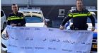 لافتة باللغة العربية تناشد المواطنين البقاء في منازلهم بهولندا ـ صورة